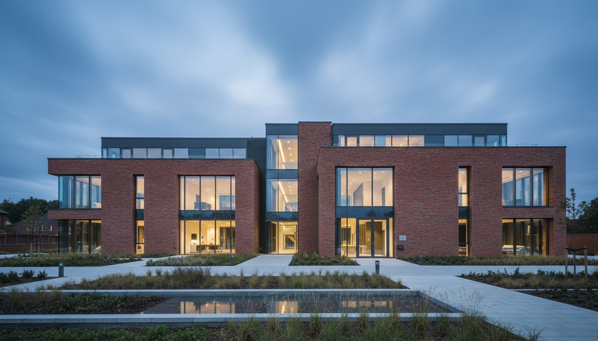 Contemporary brick and glass building at dusk